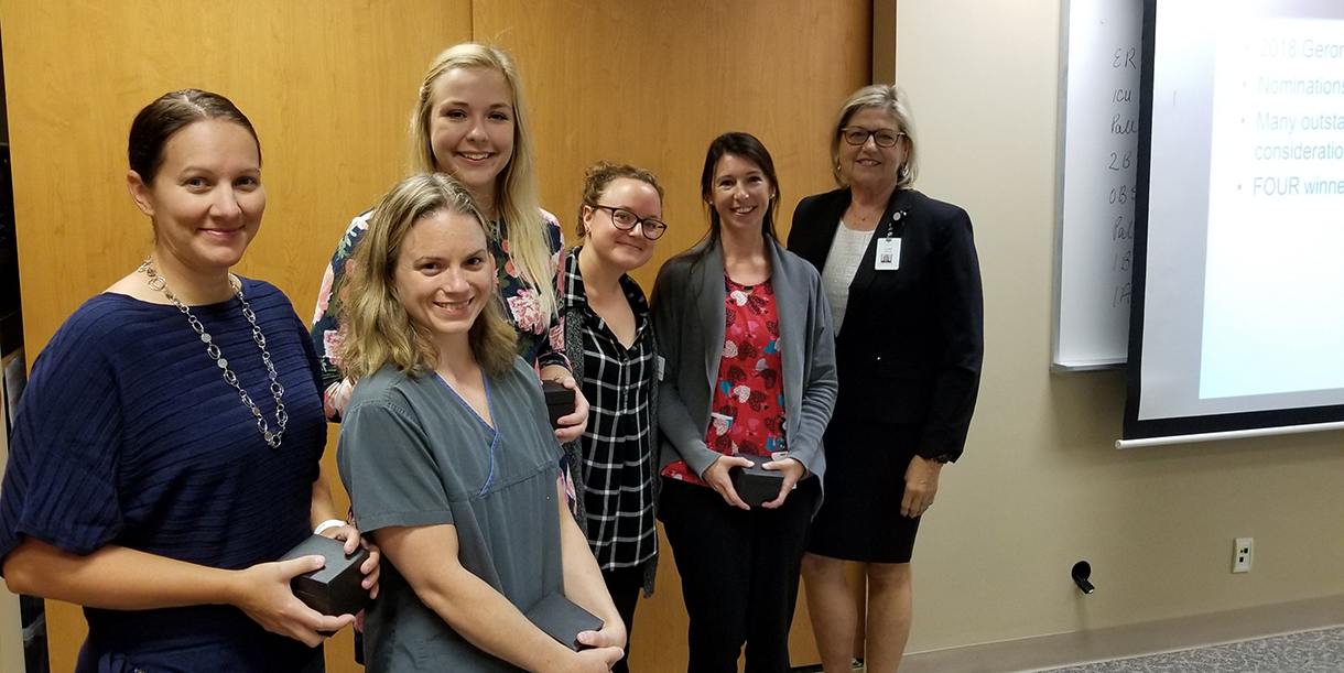 2018 Gerontological Excellence Award Winners (from left) Lorelei Kenny, Heather Brown, Holly Thomas and Sara Gillespie with Sarah Gibbens (second from right) and Linda Davis