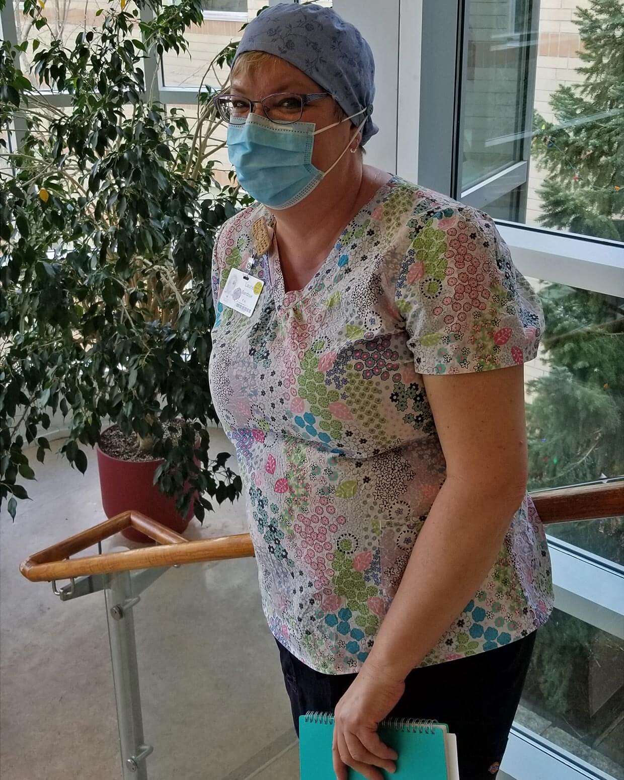 NHH RN Laurie Sandziuk is among the many local sewers generously contributing their talents to produce priority needs for area healthcare workers